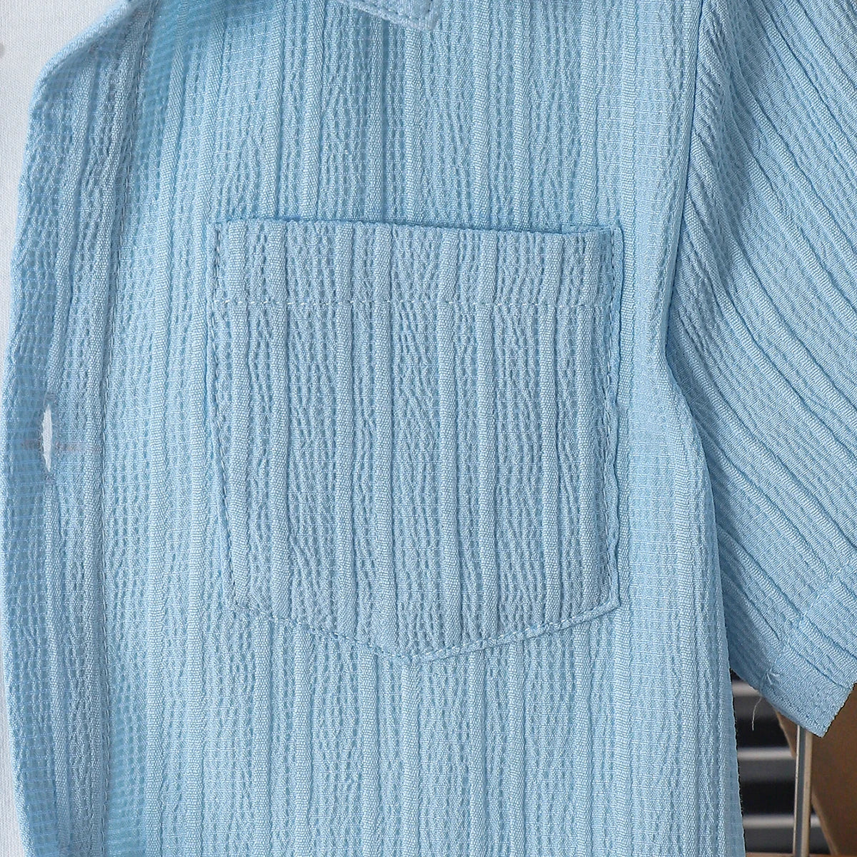 New summer men's short-sleeved woven pure blue button pocket + loose shorts two-piece set